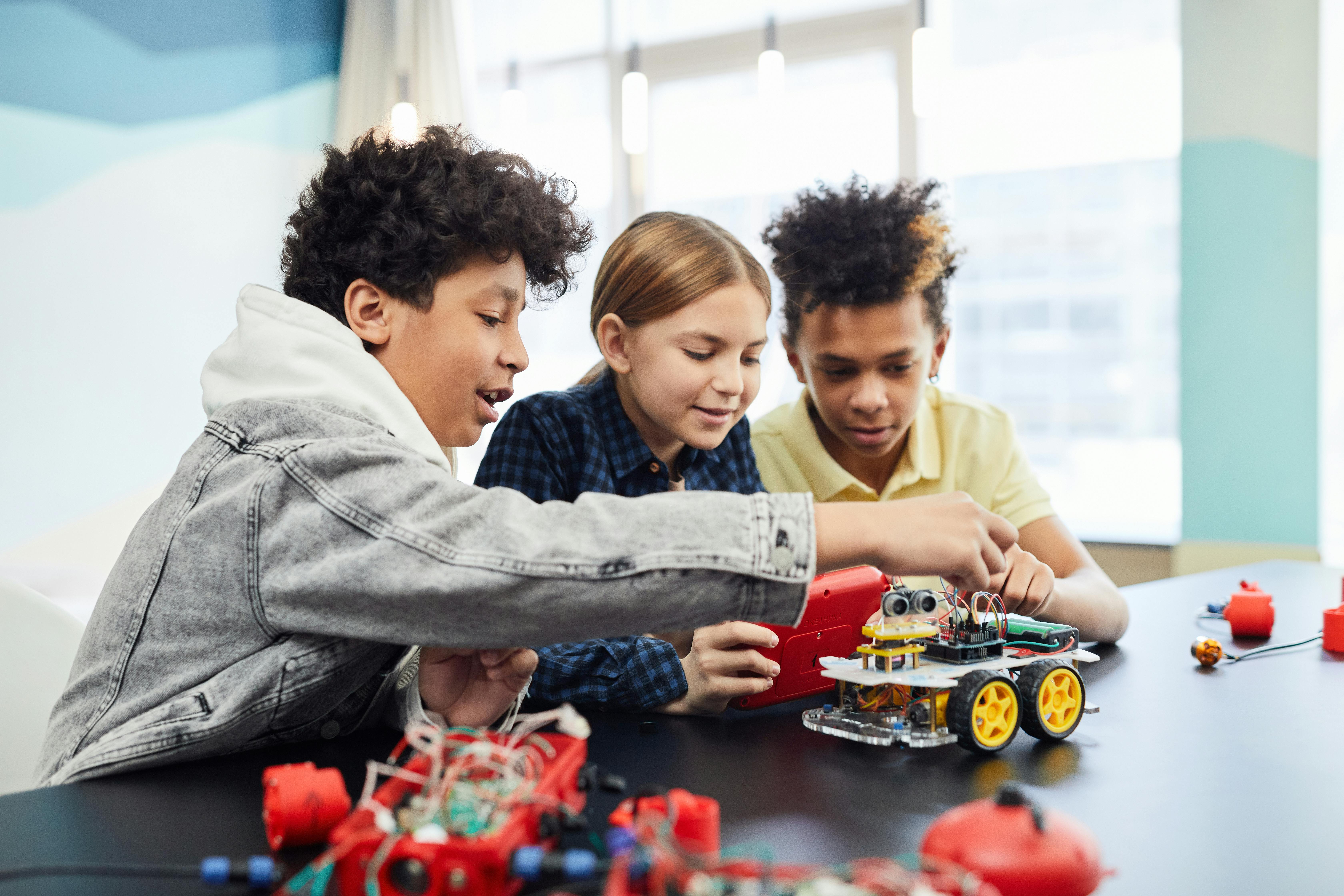 Children building a robot together
